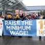 : Demonstration, led by 15 Now Minnesota, for higher pay and better working conditions at the Minneapolis-St. Paul International Airport, December 2014. Used with the permission of 15 Now Minnesota; photographer unknown. Photograph by Ginger Jentzen; used with the permission of Ginger Jentzen.