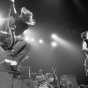 Black and white photograph of the Replacements performing at First Avenue, ca. 1985. Photograph by Daniel Corrigan.