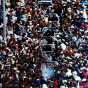 Excited fans swarm around the Minnesota Twins during their victory parade