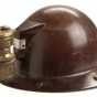 Color image of a rimmed miner's helmet worn by Adam Shapic circa 1910-1930s