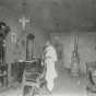 Black and white photograph of African American barber Prince Honeycutt in his Fergus Falls shop, c.1900.