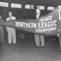 Boy Scouts and Rox management hold up their 1950 championship banner, c.1951. From the Myron Hall Collection, Stearns History Museum and Research Center, St. Cloud.