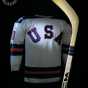 Color image of Bill Baker’s 1980 Olympic jersey and hockey stick. Photographed on November 3, 2004, and shared via Flickr by public.resource.org.