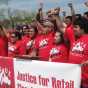 Members of the Centro de Trabajadores Unidos en la Lucha (Center of Workers United in Struggle, CTUL) rally to support retail cleaning workers and their legal fight to collect unpaid wages from big-box employers like Target and K-Mart, 2014. Used with the permission of CTUL; photographer unknown.