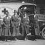 Black and white photograph of members of the St. Paul Chapter of the Red Cross, Motor Corps, 1918.