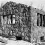 Black and white photograph of construction of a stone building by CCC Company 2710, Gooseberry Falls, ca. 1938.