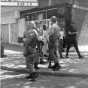 Black and white photograph of National Guardsmen patrolling Plymouth Avenue in North Minneapolis, July 1967.