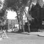 Black and white photograph of St. Paul's Central Park, c.1956. Its view looks south along Central Park Place West; the former Blood mansion is in the foreground.