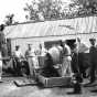 Black and white photograph of men working on a fair building at the Murray County Fairgrounds in Slayton, 1950s.