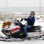 Polaris RMK series snowmobile. Introduced in 1996, the RMK series of snowmobiles Polaris’s entry into the deep snow mountain sled market. Photograph taken in Island Park, Idaho, by Flickr user MotoWebMistress. CC BY 2.0.