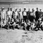 Black and white photograph of German prisoners of war outside a farm building in Moorhead, ca. 1943–1945. Used with the permission of the Historical and Cultural Society of Clay County. 