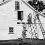 Black and white photograph of German prisoners of war painting a barn in Moorhead, ca. 1943–1945. Used with the permission of the Historical and Cultural Society of Clay County. 