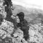 Black and white photograph of a Thirty-fourth Infantry Division officer scanning German movements on the approach to Casino, 1944.