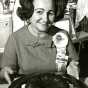 Black and white photograph of Ella Helfrich and her prize-winning Tunnel of Fudge Bundt cake, 1966. Used with the permission of General Mills, Inc.