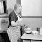 Black and white photograph of a woman using an electric mixer, 1938. Photographed by the Minneapolis Star Journal.