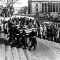 Black and white photograph of color Guard officers carrying the body of Hubert H. Humphrey down the steps of the Minnesota State Capitol in St. Paul, January 1978. 