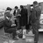 Black and white photograph of Tailgaters, Metropolitan Stadium, Bloomington, Minnesota. Photographer: Gillis, Minneapolis Star Tribune, 1964.