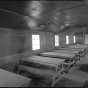 Classroom in the education building (Building 7), CCC Camp Rabideau F-50. Photo by Jerry  Mathiason, 1994. From box 1 (144.G.8.4F) of Historic American Buildings Survey records related to Minnesota structures, 1882-2001, 1883. Manuscripts Collection, Minnesota Historical Society, St. Paul.