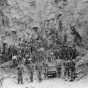 Black and white photograph of miners in the pit of the Tower-Soudan mine, 1890.