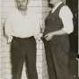 Arthur “Doc” Barker, left, with jailer, William Gates