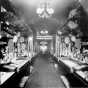 Black and white photograph of a Minnesota exhibit of farm product in railway car, Great Northern Railway, Western Governors Special, ca. 1911.