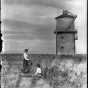 Two women with bicycles near Mni Owe Sni (Coldwater Spring)