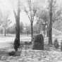 Black and white photograph of a monument erected to the memory of Colonel Josiah Snelling in front of the Fort Snelling Memorial Chapel, 1929.