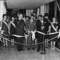 Black and white photograph of he opening of the first Minneapolis skyway, connecting the Northstar Center and the Northwestern National Bank; Leslie Park is at left, 1962.