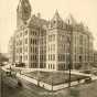 Black and white photograph of the second Ramsey County courthouse, c.1908. This view is looking northeast. The Victory parking ramp later occupied this space.