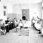 Black and white photograph of sewing class at the State School, c.1905.