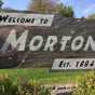 Color image of a sign welcoming visitors to the city of Morton, 2016. The sign is made out of Morton gneiss. Photograph by Paul Nelson.