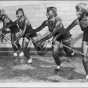 University of Minnesota students, and members of the campus Aquatic League, practice a dance number in blackface for the comic water ballet to be performed in the Cooke Hall exhibition pool on Friday night. L to R: Susan Fredrickson of Santa Cruz, California; Trudy Schlek of Milwaukee, Wisconsin; Kit Thiele of Madison, Minnesota; and Gerrie Ghent of St. Paul, rehearse a "Licorice Lindy" dance number with canes in Cooke Hall. Originally published in the Minneapolis Tribune, April 14, 1950. 