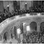 Black and white photograph of thousands of farmers gathering at the Minnesota State Capitol to hear Governor Floyd B. Olson talk on farm relief, ca. 1935.