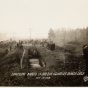 Black and white photograph of mass grave at Moose Lake after the fire, 1918. 