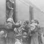 Black and white photograph of the National Guard giving out clothing to refugees, 1918. 