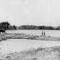 Black and white photograph of Jacob Brower at the Lake Itasca basin at DeSoto Lake, 1889.  