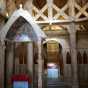 Color image of the baldachin and the chancel inside the Hopperstad Stave Church replica, April 2, 2017. Photographed by Kaci Johnson.