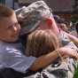 Color image of a soldier of Second Battalion, 135th Infantry, Thirty-fourth Division, returning home after a deployment, 2008.