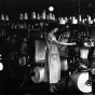 photograph of a woman operating a Munsingwear knitting machine