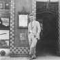 Black and white photograph of Adolf Dehn at the Weyhe Gallery, c.1930.