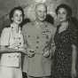 Black and white photograph of Melvin J. Maas with daughter Patricia and wife Katherine, 1952.