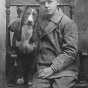 Black and white photograph of Charles Lindbergh with his dog "Dingo," c.1912. 