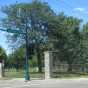 Color image of the southeast corner of Pioneers and Soldiers Memorial Cemetery Cemetery, at the corner of East Lake Street and Twenty-first Avenue South in Minneapolis, 2016. Photographed by Paul Nelson.