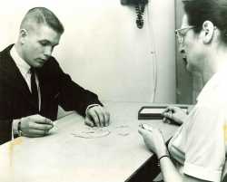 Black and white photograph of a staff member administering a vocational test at the Jewish Vocational Society of St. Paul, undated.