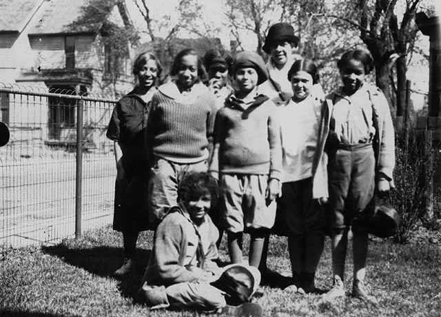 Black and white photograph of individuals starting a hike from Phyllis Wheatley House with Ethel Ray (later Ethel Ray Nance), 1926.