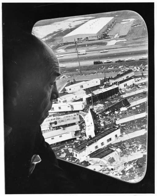 Minnesota Governor Karl Rolvaag flying over Fridley tornado wreckage