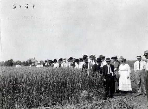 Black and white photograph of a group touring Northwest Experiment Station. 