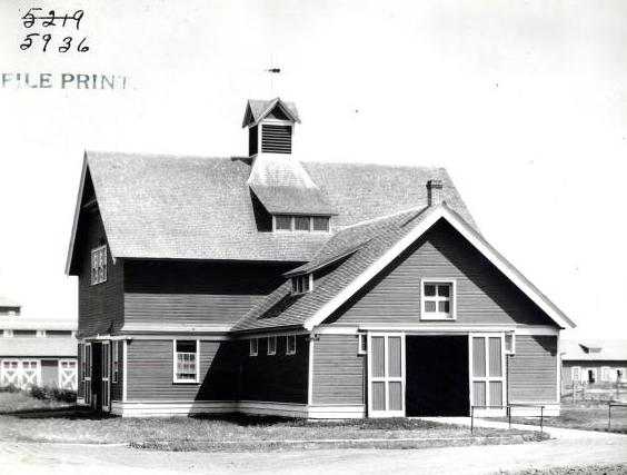 Black and white photograph of the horse barn at the Northwest Experiment Station.   