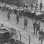 Black and white photograph of National Guard troops keeping a crowd back during a raid on strike headquarters in Minneapolis, 1934.