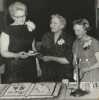 Black and white photograph of BPWC president Marian Olson, Mae Rideout, and June Shaver at a party celebrating the Crookston BPWC’s forty-fifth anniversary.